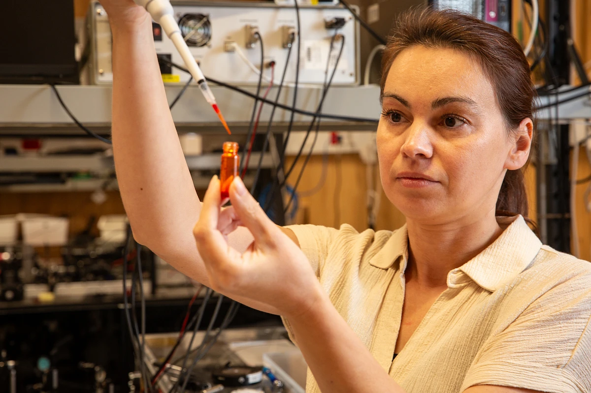 Controlling Light with Light Using Dyed Liquid Crystals